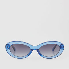 CALLA OVAL SUNGLASSES WITH GRADIENT GREY LENS IN TRANSPARENT BLUE